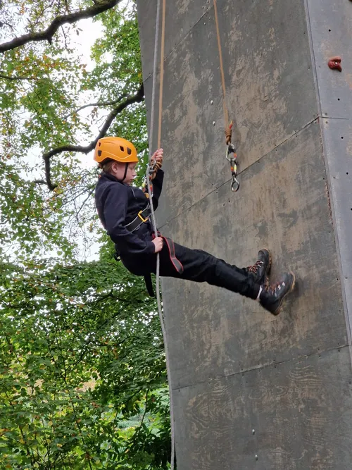 Olivia abseiling down with determination